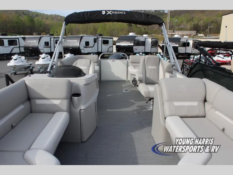 Slide: The Image of 2025 Godfrey Sweetwater 2286SBX pontoon boat with spacious seating at a dealership. - 6