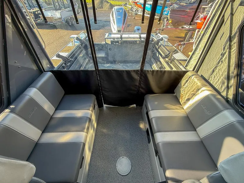 Slide: The Image of Interior of 2021 Hewescraft 220 Ocean Pro Hard Top with cushioned seating. - 11