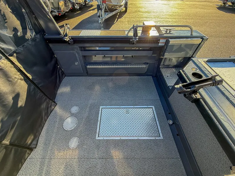 Slide: The Image of 2021 Hewescraft 220 Ocean Pro Hard Top boat interior with storage and rod holders. - 13