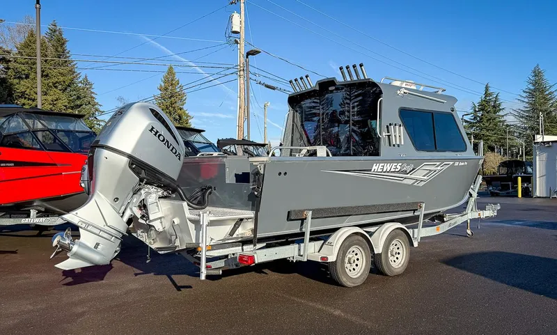 Slide: The Image of 2021 Hewescraft 220 Ocean Pro Hard Top boat on trailer with Honda outboard motor. - 3