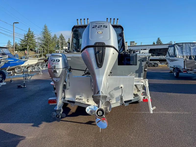 Slide: The Image of 2021 Hewescraft 220 Ocean Pro Hard Top with Honda outboard motors in a boatyard. - 4