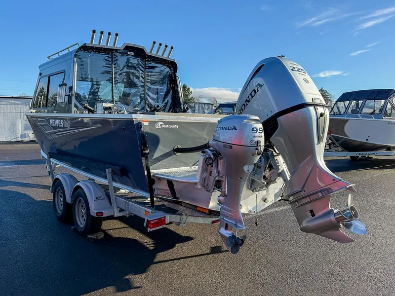 Slide: The Image of 2021 Hewescraft 220 Ocean Pro Hard Top boat with Honda outboard engines on trailer. - 5