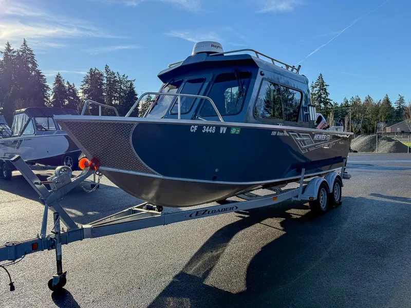 Slide: The Image of 2021 Hewescraft 220 Ocean Pro Hard Top boat on trailer, parked outdoors. - 6