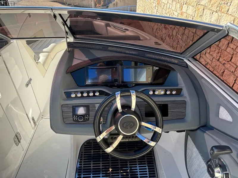 Slide: The Image of 2017 Cobalt R5 boat dashboard with steering wheel and control panel. - 11