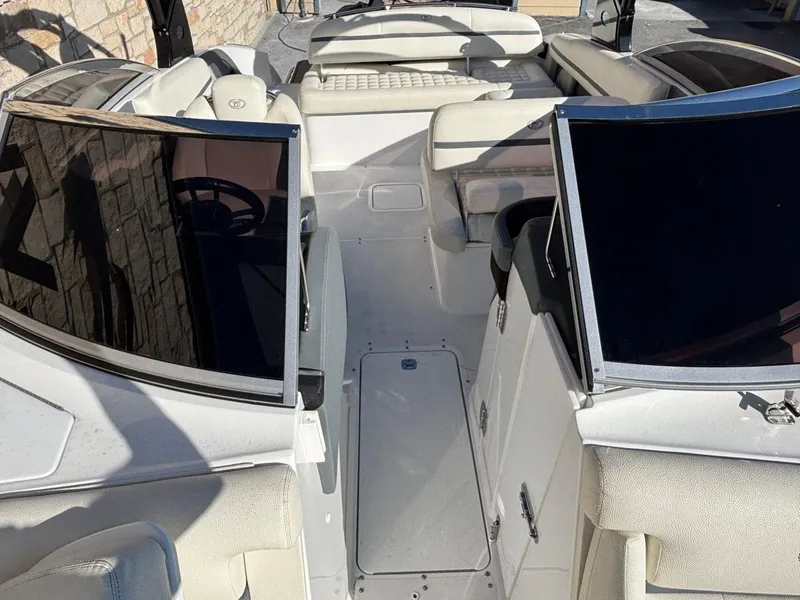 Slide: The Image of 2017 Cobalt R5 boat interior with white seating and dual windshields. - 13