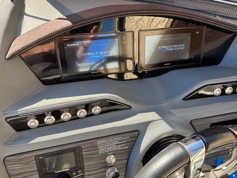 Slide: The Image of Dashboard of a 2017 Cobalt R5 boat with Garmin displays and control buttons. - 15
