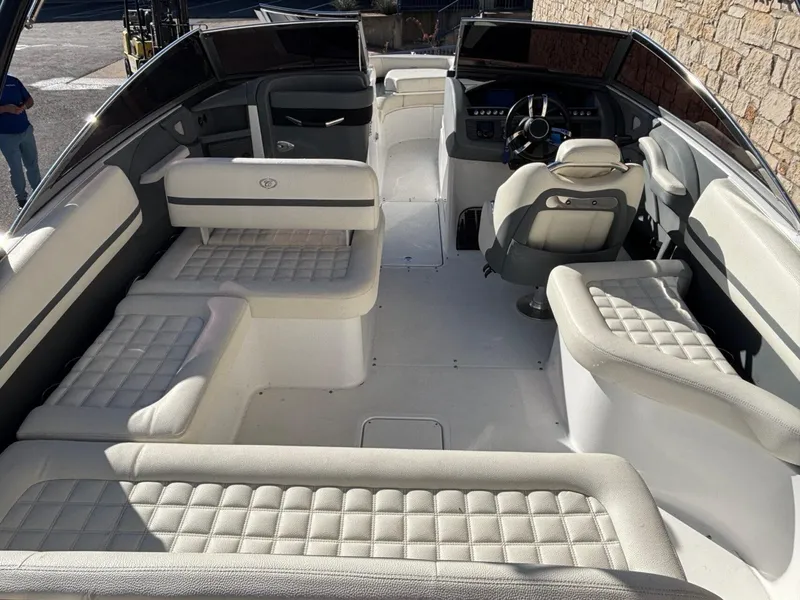 Slide: The Image of 2017 Cobalt R5 boat interior with luxurious white seating and modern dashboard. - 7