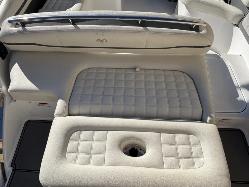 Slide: The Image of 2017 Cobalt R5 boat interior with cushioned seating and cup holder. - 9