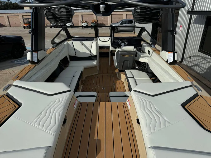 Slide: The Image of 2025 Nautique G23 boat interior with luxurious seating and modern design. - 13