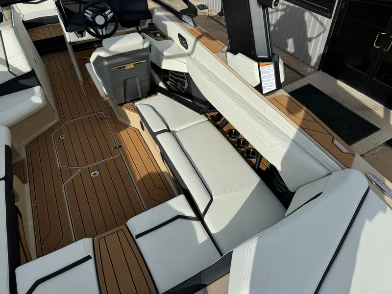 Slide: The Image of 2025 Nautique G23 boat interior with luxurious seating and modern design. - 15