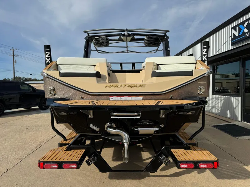 Slide: The Image of 2025 Nautique G23 boat rear view, showcasing sleek design and modern features. - 3