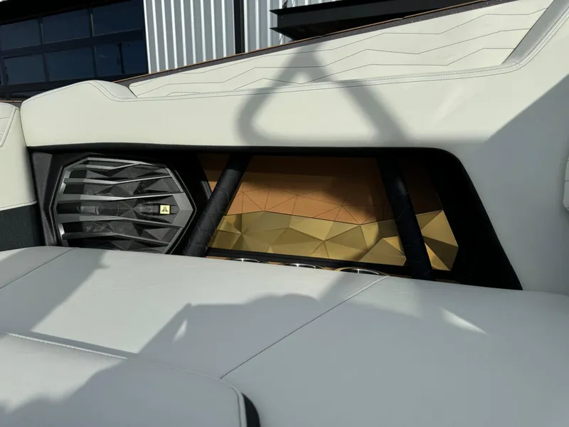 Slide: The Image of 2025 Nautique G23 interior with modern speaker and geometric design accents. - 39