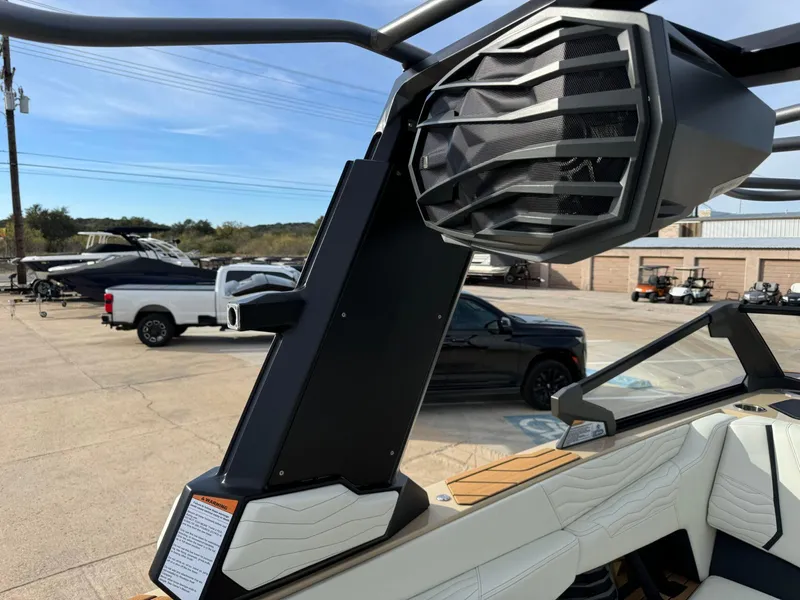 Slide: The Image of 2025 Nautique G23 boat with advanced speaker system and sleek interior design. - 42