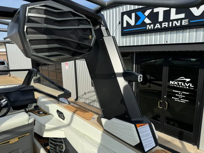 Slide: The Image of 2025 Nautique G23 boat with advanced speaker system at NXT LVL Marine dealership. - 43