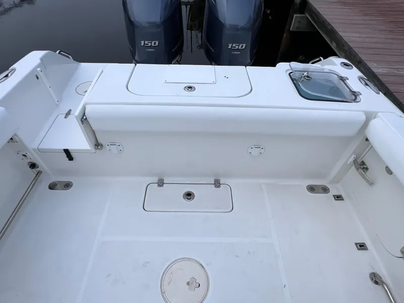 Slide: The Image of 2017 Sea Hunt Gamefish 25 boat deck with twin 150 engines, clean condition. - 23