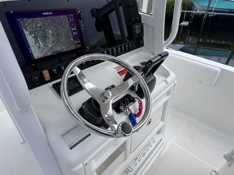 Slide: The Image of 2017 Sea Hunt Gamefish 25 helm with navigation system and steering wheel. - 32