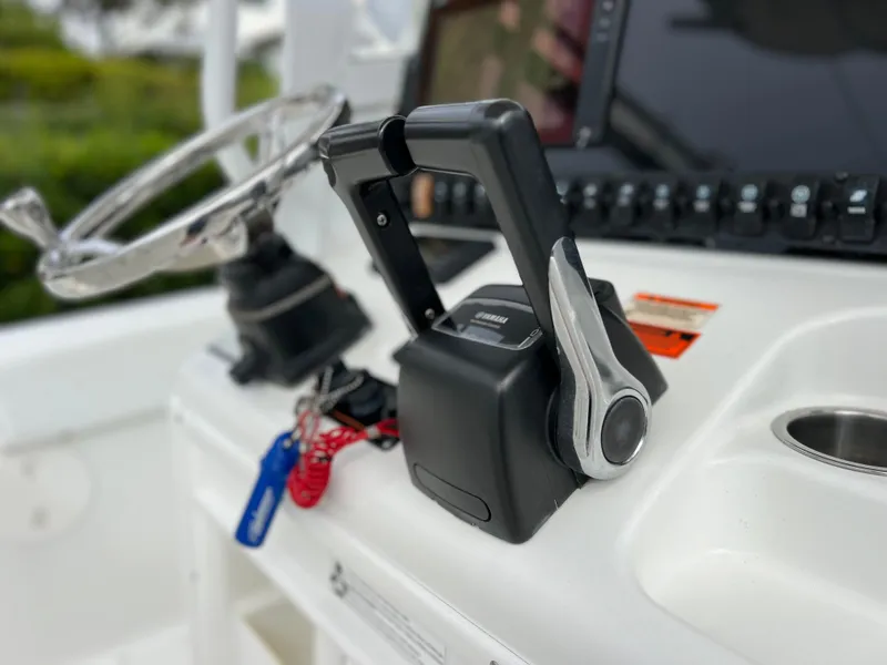 Slide: The Image of Close-up of 2017 Sea Hunt Gamefish 25 boat controls and steering wheel. - 34