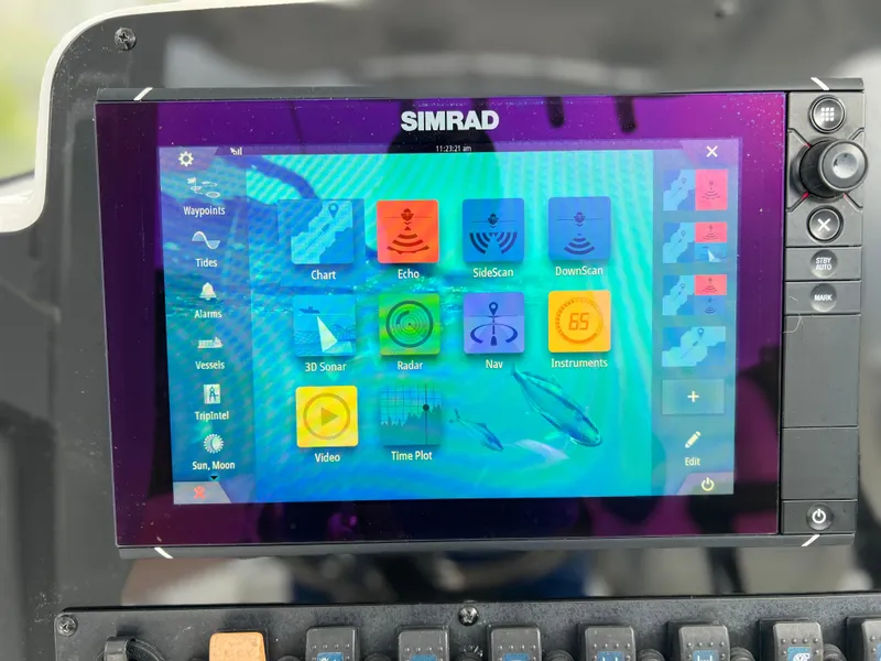 Slide: The Image of Simrad navigation display on 2017 Sea Hunt Gamefish 25 boat, showing various marine functions. - 36