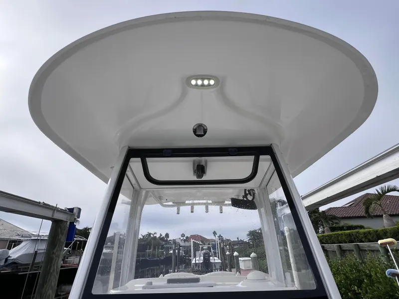 Slide: The Image of 2017 Sea Hunt Gamefish 25 boat, clean condition, 200 hours, docked with T-top view. - 42