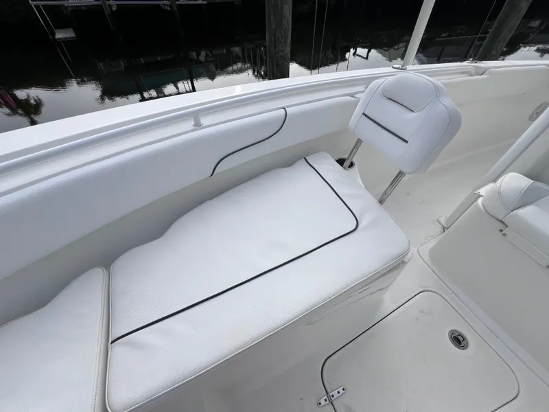 Slide: The Image of 2017 Sea Hunt Gamefish 25 boat interior with clean white seating. - 48