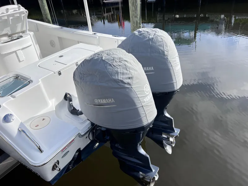 Slide: The Image of 2017 Sea Hunt Gamefish 25 with twin Yamaha engines, docked, clean condition. - 9