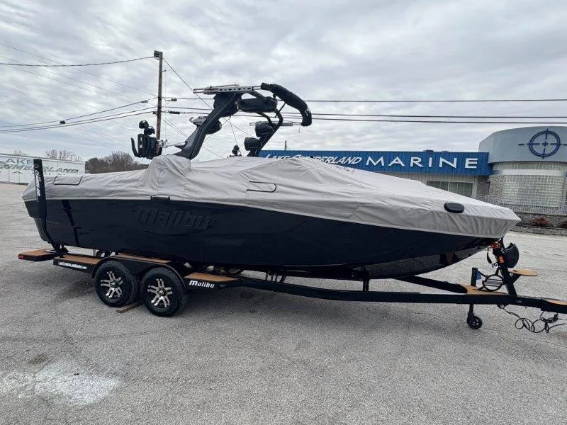 Slide: The Image of 2025 Malibu 25 LSV boat covered on trailer at Lake Cumberland Marine. - 24