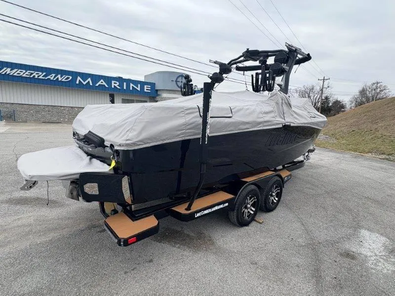 Slide: The Image of 2025 Malibu 25 LSV boat covered on trailer at Cumberland Marine. - 25