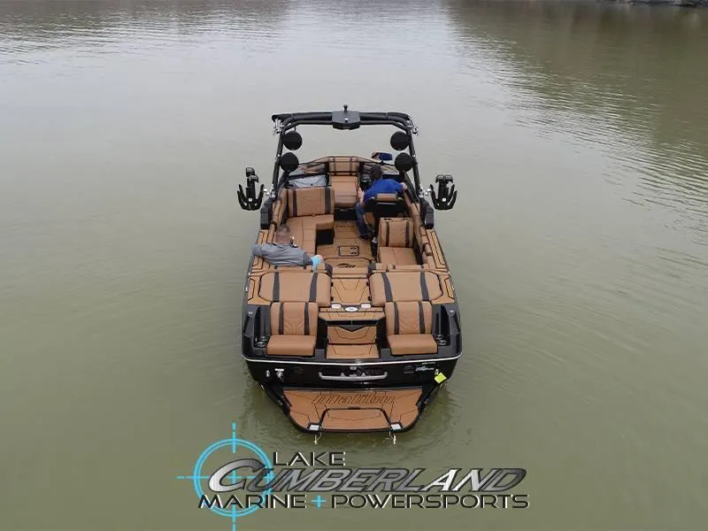 Slide: The Image of 2025 Malibu 25 LSV boat on calm water, viewed from above. - 3