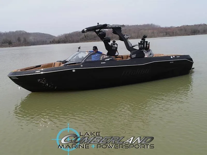 Slide: The Image of 2025 Malibu 25 LSV boat on calm lake waters, Lake Cumberland Marine logo visible. - 4