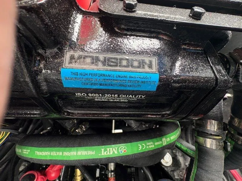 Slide: The Image of Close-up of a 2025 Malibu 25 LSV Monsoon engine with ISO 9001:2015 certification label. - 40