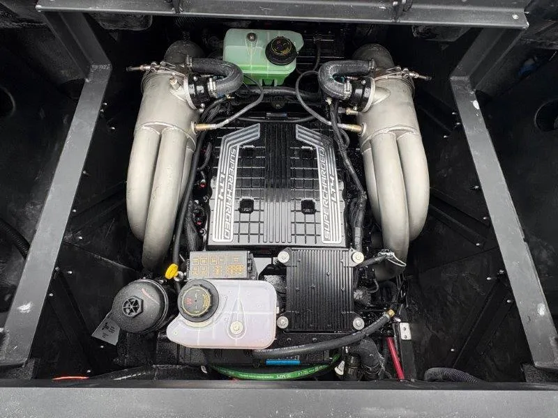 Slide: The Image of Engine compartment of a 2025 Malibu 25 LSV boat, showcasing a supercharged engine. - 41