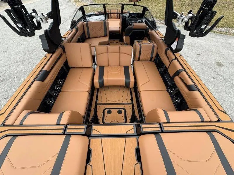 Slide: The Image of Luxurious interior of 2025 Malibu 25 LSV boat with tan leather seating. - 55