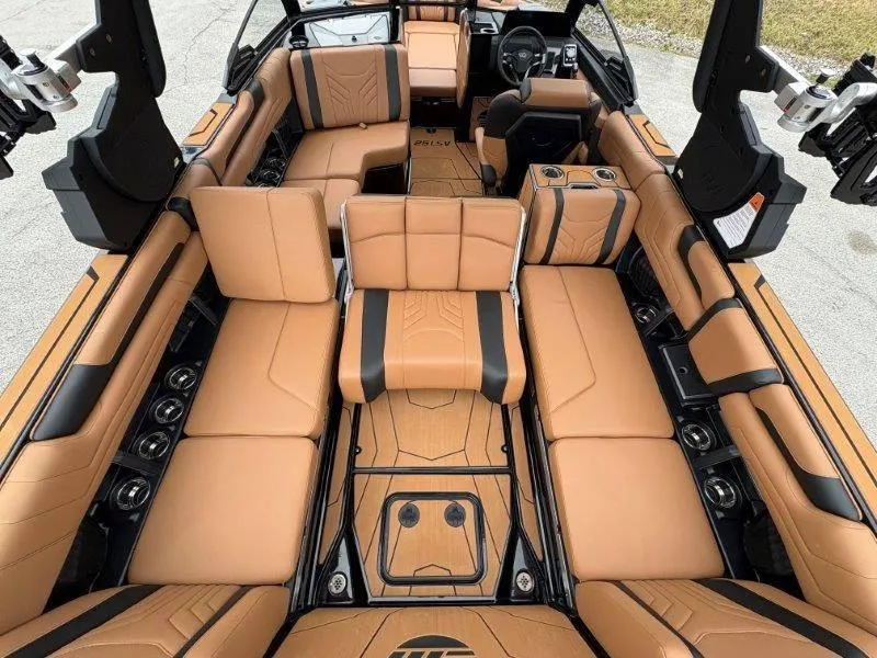 Slide: The Image of Luxurious interior of 2025 Malibu 25 LSV boat with tan leather seating. - 63