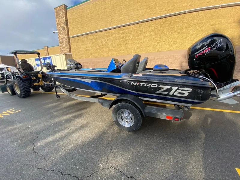 The Image of 2025 Nitro Z18 Pro boat on trailer, parked outdoors. - 0