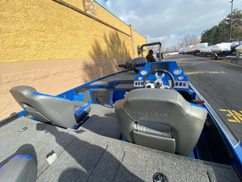Slide: The Image of 2025 Nitro Z18 Pro boat interior with blue accents and dual seating. - 4