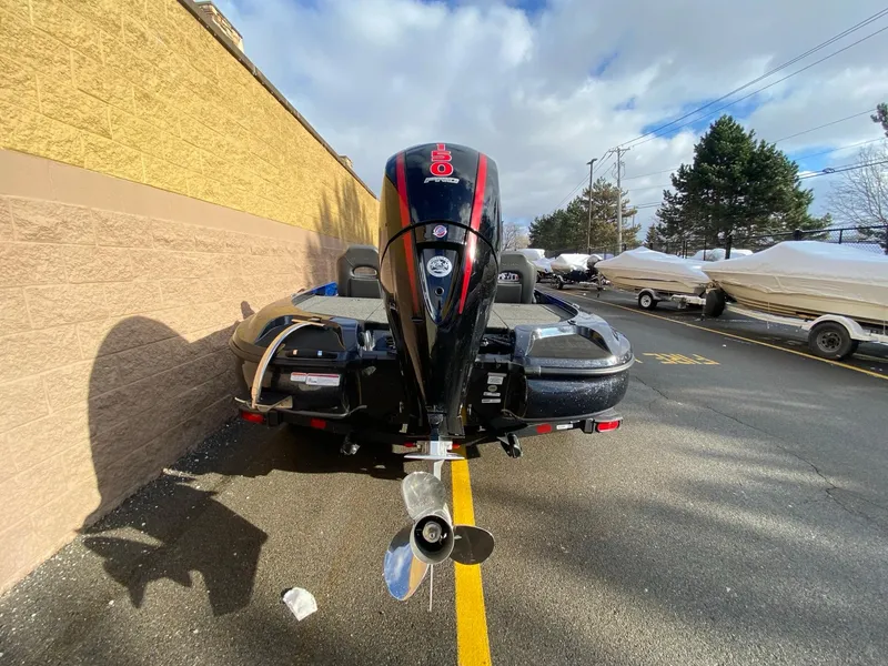 Slide: The Image of 2025 Nitro Z18 Pro boat with powerful outboard motor in parking lot. - 5