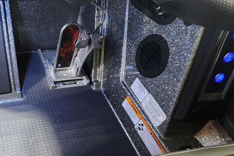 Slide: The Image of Interior of 2025 Ranger Z520R Cup-Equipped boat with pedal and control panel. - 13