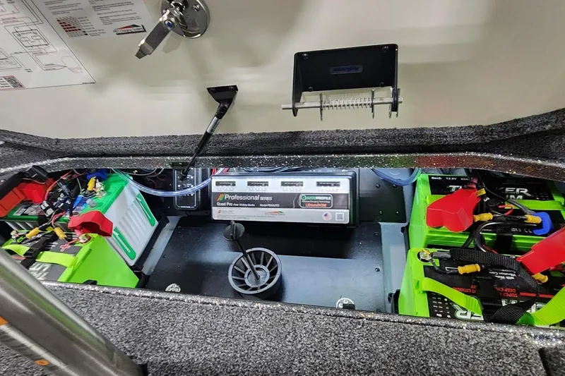Slide: The Image of 2025 Ranger Z520R Cup-Equipped boat battery compartment with professional series charger and wiring. - 14