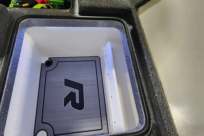 Slide: The Image of 2025 Ranger Z520R Cup-Equipped storage compartment with sleek interior design. - 16