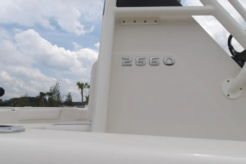 Slide: The Image of 2025 Ranger 2660 Bay boat with clear sky background. - 21