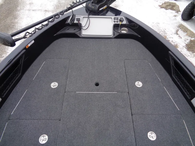 Slide: The Image of 2025 Ranger 1880MS boat deck with storage compartments and control panel. - 14