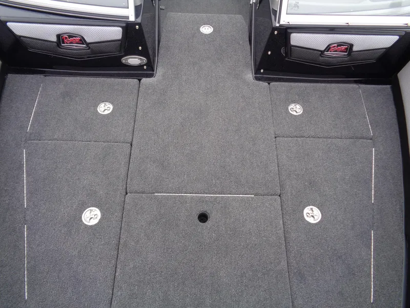 Slide: The Image of 2025 Ranger 1880MS boat interior with carpeted flooring and storage compartments. - 17