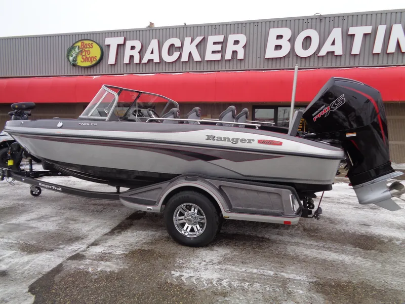 Slide: The Image of 2025 Ranger 1880MS boat on trailer at Tracker Boating store. - 2
