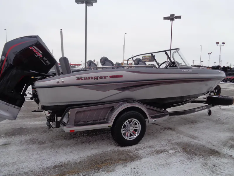 Slide: The Image of 2025 Ranger 1880MS boat on trailer in snowy parking lot. - 3