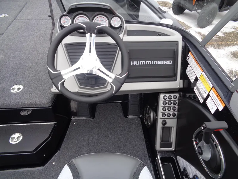 Slide: The Image of 2025 Ranger 1880MS boat dashboard with Humminbird display and steering wheel. - 8