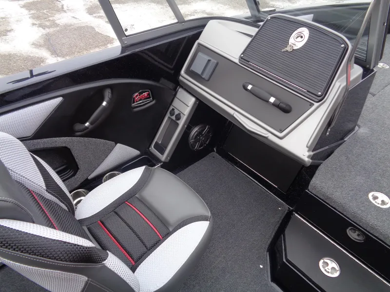 Slide: The Image of 2025 Ranger 1880MS boat interior with modern dashboard and seating. - 9