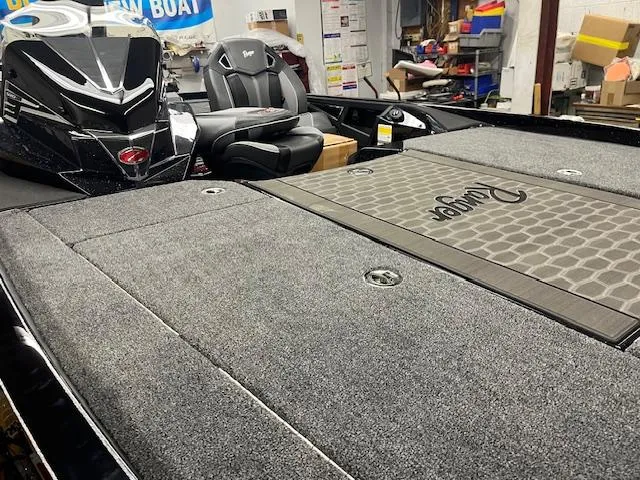 Slide: The Image of 2025 Ranger Z520R Cup-Equipped boat interior with carpeted deck and seating. - 3