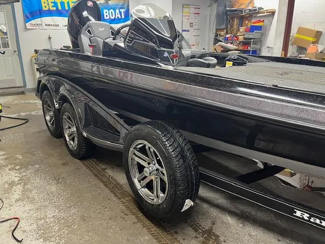Slide: The Image of 2025 Ranger Z520R Cup-Equipped boat in a garage, showcasing sleek design and triple-axle trailer. - 4