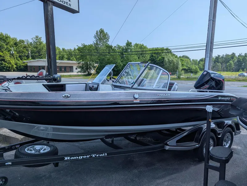 The Image of 2025 Ranger 2080MS boat on trailer, parked outdoors, showcasing sleek design and modern features. - 0