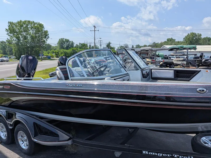 Slide: The Image of 2025 Ranger 2080MS boat on trailer, parked outdoors under a clear sky. - 1